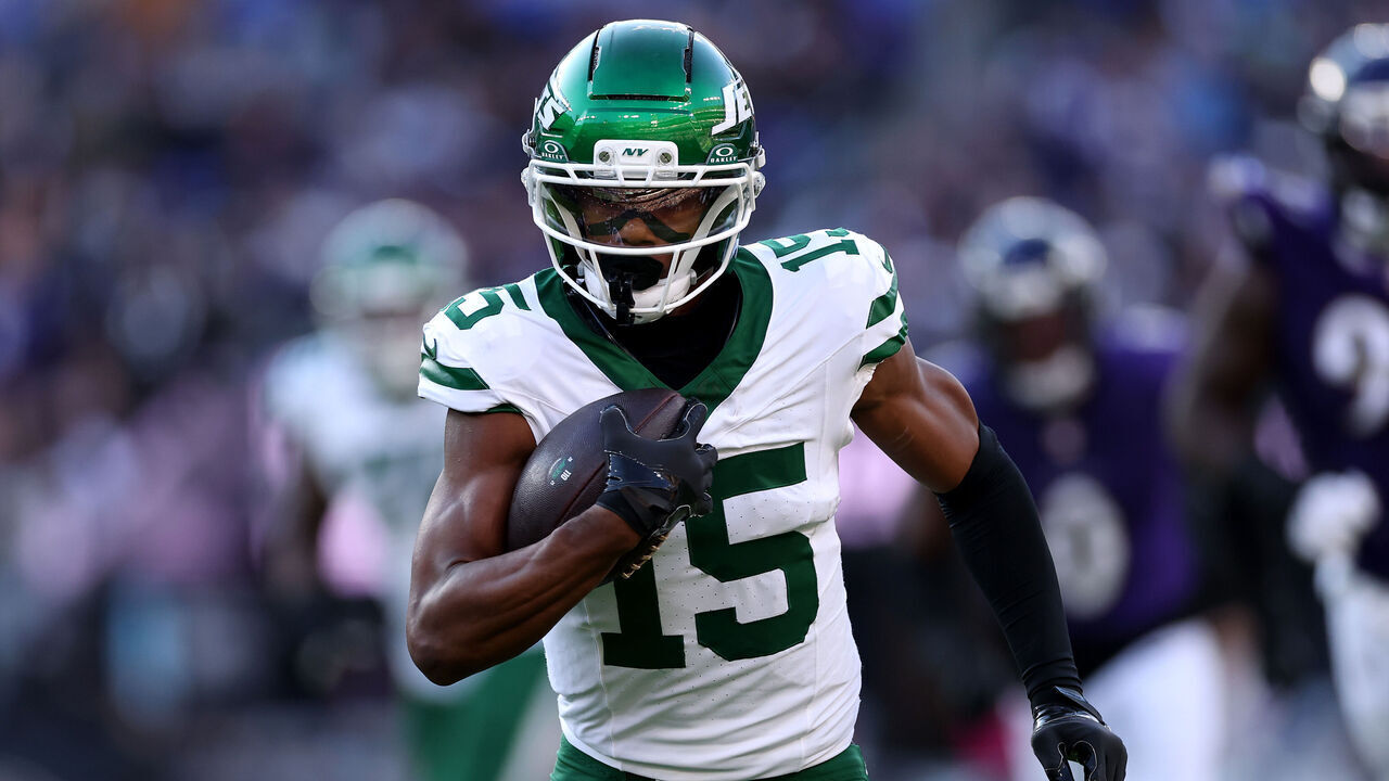 BALTIMORE, MARYLAND - NOVEMBER 23: Adonai Mitchell #15 of the New York Jets rushes for yards in the third quarter of the game against the Baltimore Ravens at M&T Bank Stadium on November 23, 2025 in Baltimore, Maryland.