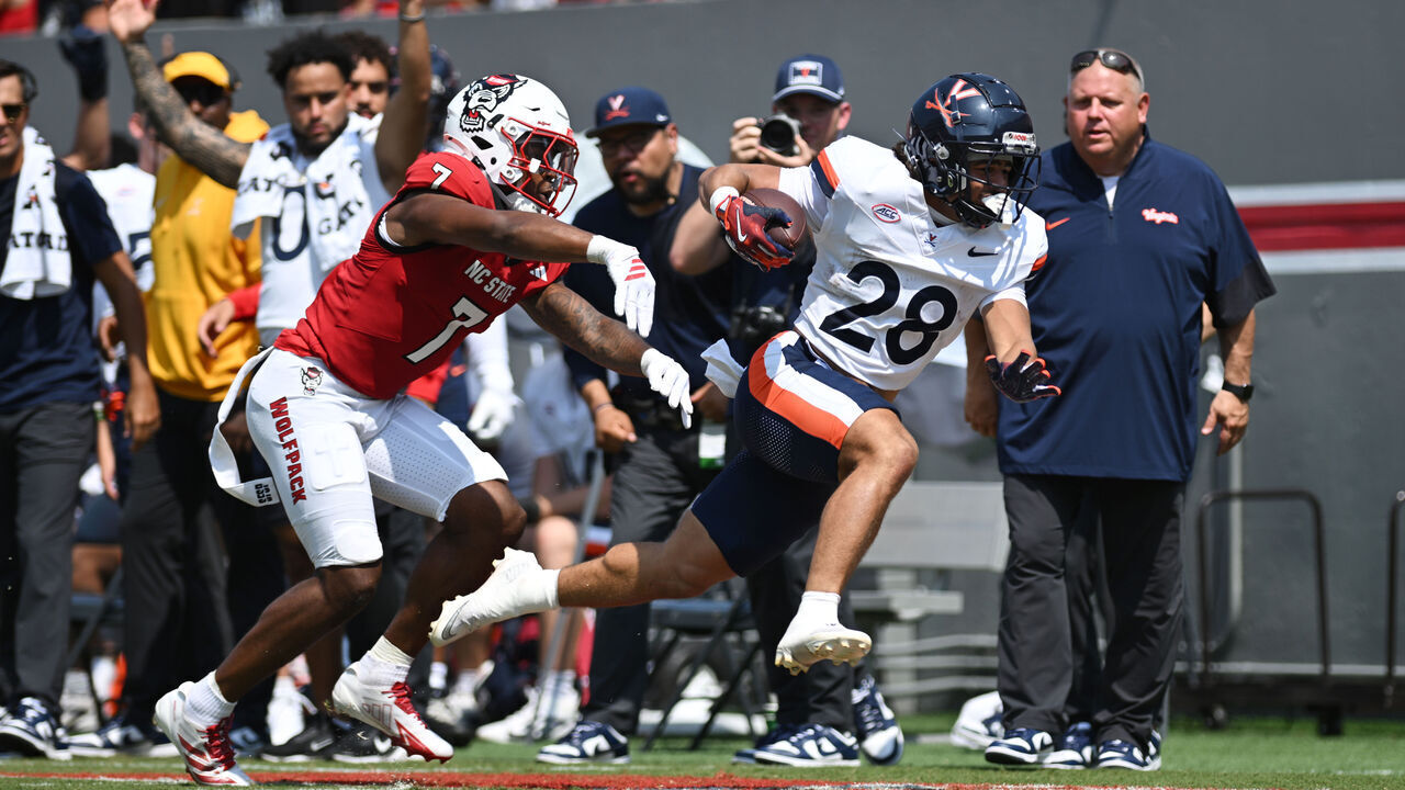 RALEIGH, NC - SEPTEMBER 06: Cornerback Brian Nelson II #7 of the NC State Wolfpack pushes Running Back Noah Vaughn #28 of the Virginia Cavaliers out of bounds during the College Football game between the NC State Wolfpack and the Virginia Cavaliers on September 6, 2025 at Carter-Finley Stadium in Raleigh, North Carolina.