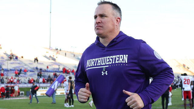 EVANSTON, ILLINOIS - OCTOBER 08: Head coach Pat Fitzgerald of the Northwestern Wildcats runs off the field after losing to the Wisconsin Badgers at Ryan Field on October 08, 2022 in Evanston, Illinois.