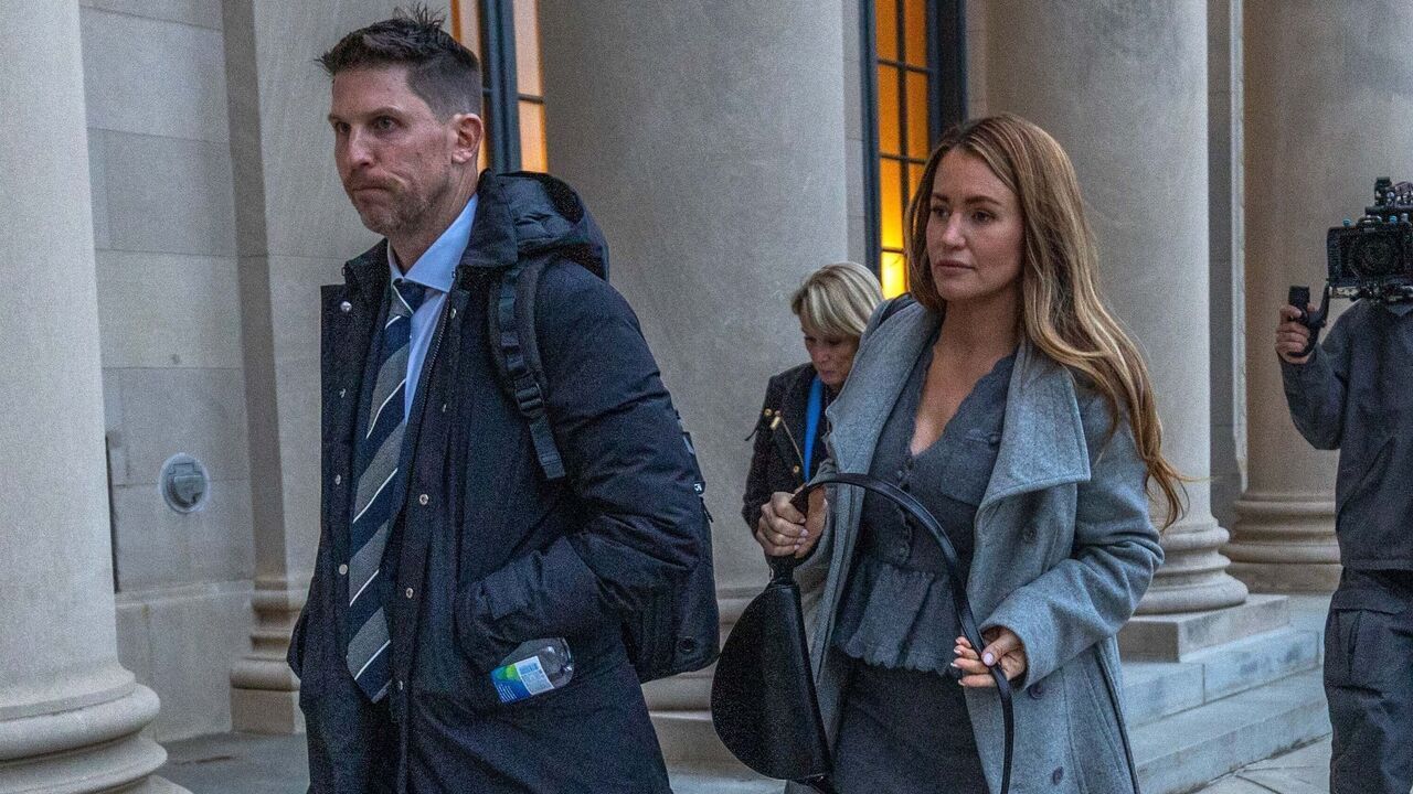 CHARLOTTE, NORTH CAROLINA - DECEMBER 1: NASCAR Driver Denny Hamlin (L) and wife Jordan Fish depart the Charles R Jonas Federal Building on December 1, 2025 in Charlotte, North Carolina. Jury selection and an opening statement began an antitrust lawsuit filed by Michael Jordan's 23XI Racing team against NASCAR.
