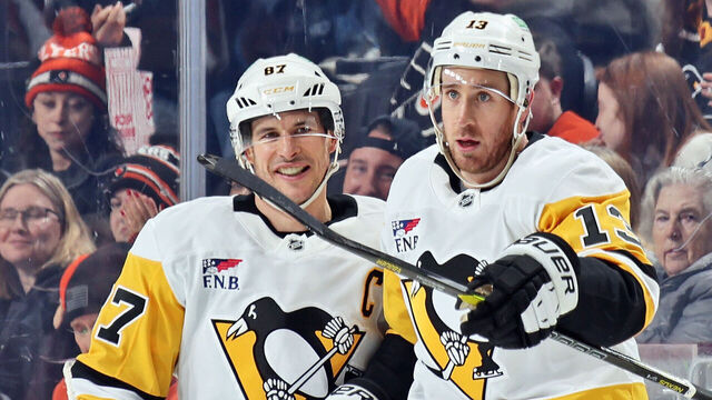 PHILADELPHIA, PENNSYLVANIA - DECEMBER 01: Kevin Hayes #13 of the Pittsburgh Penguins celebrates his third period goal against the Philadelphia Flyers with Sidney Crosby #87 at the Xfinity Mobile Arena on December 1, 2025 in Philadelphia, Pennsylvania. The Penguins went on to defeat the Flyers 5-1.