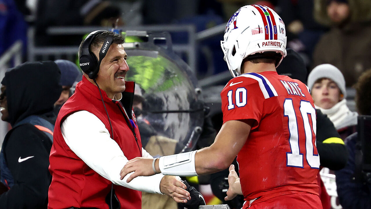 FOXBOROUGH, MASSACHUSETTS - DECEMBER 01: Head coach Mike Vrabel of the New England Patriots and Drake Maye #10 of the New England Patriots shake hands during the second quarter of the game against the New York Giants at Gillette Stadium on December 01, 2025 in Foxborough, Massachusetts.