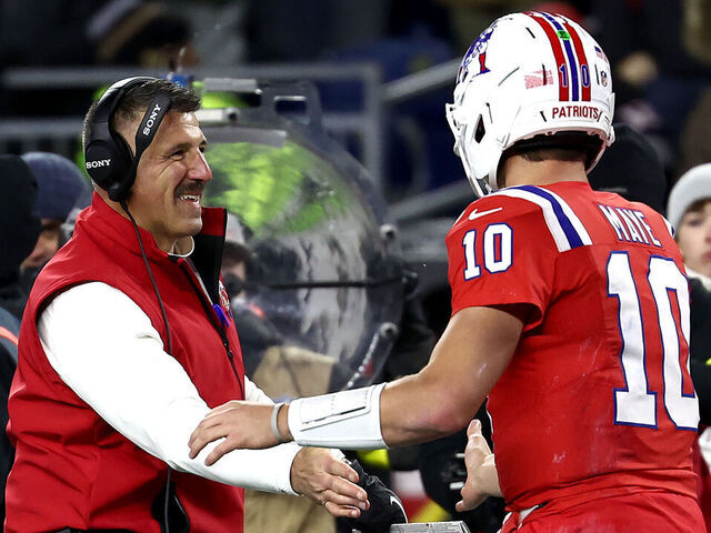 FOXBOROUGH, MASSACHUSETTS - DECEMBER 01: Head coach Mike Vrabel of the New England Patriots and Drake Maye #10 of the New England Patriots shake hands during the second quarter of the game against the New York Giants at Gillette Stadium on December 01, 2025 in Foxborough, Massachusetts.