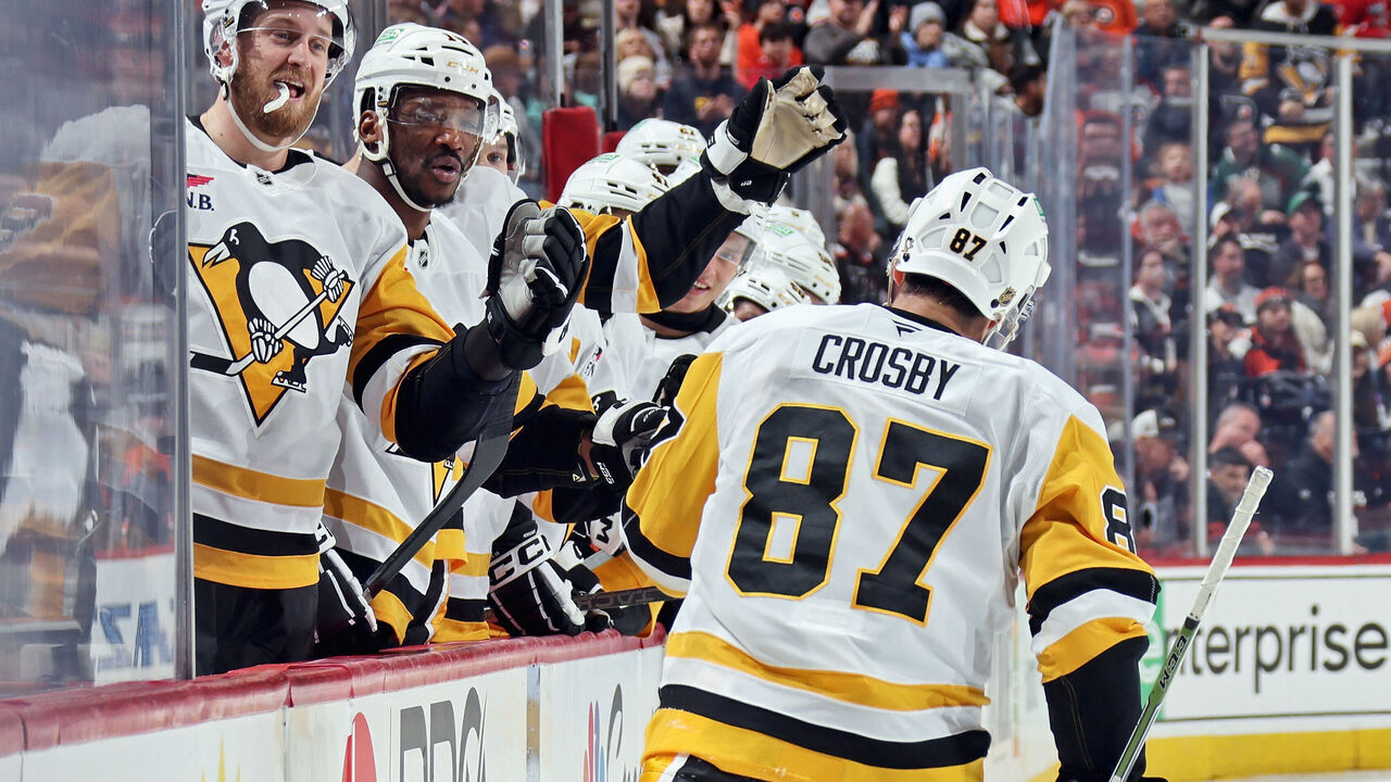 PHILADELPHIA, PENNSYLVANIA - DECEMBER 01: Sidney Crosby #87 of the Pittsburgh Penguins celebrates his second period power-play goal against the Philadelphia Flyers with his teammates on the bench at the Xfinity Mobile Arena on December 1, 2025 in Philadelphia, Pennsylvania.