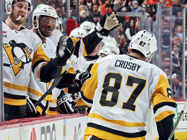 PHILADELPHIA, PENNSYLVANIA - DECEMBER 01: Sidney Crosby #87 of the Pittsburgh Penguins celebrates his second period power-play goal against the Philadelphia Flyers with his teammates on the bench at the Xfinity Mobile Arena on December 1, 2025 in Philadelphia, Pennsylvania.