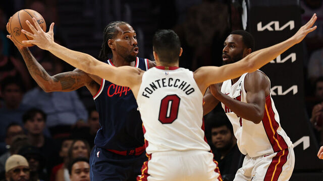 MIAMI, FLORIDA - DECEMBER 01: Kawhi Leonard #2 of the LA Clippers controls the ball against Simone Fontecchio #0 of the Miami Heat at Kaseya Center on December 01, 2025 in Miami, Florida.