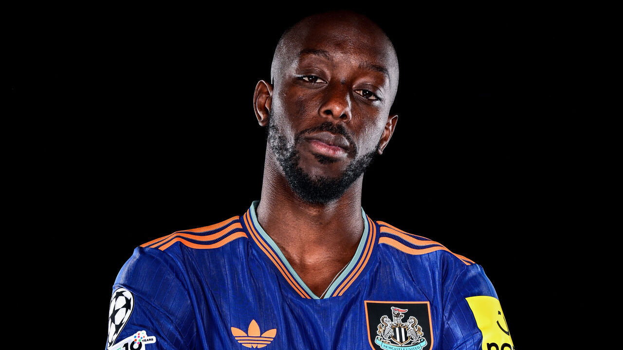 NEWCASTLE UPON TYNE, ENGLAND - SEPTEMBER 01: Yoane Wissa poses for photographs wearing a third kit at the Newcastle United Training Centre after signing for the club on September 01, 2025 in Newcastle upon Tyne, England.