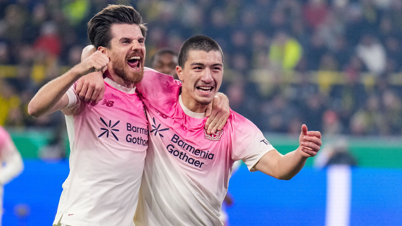 DORTMUND, GERMANY - DECEMBER 2: Jonas Hofmann of Bayer 04 Leverkusen and Ibrahim Maza of Bayer 04 Leverkusen celebrate their team's first goal during the DFB Cup round of 16 match between Borussia Dortmund and Bayer 04 Leverkusen at Signal Iduna Park on December 2, 2025 in Dortmund, Germany.