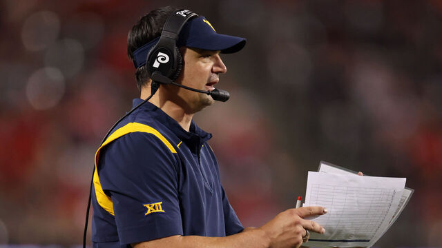 TUCSON, ARIZONA - OCTOBER 26: Head coach Neal Brown of the West Virginia Mountaineers watches the action during the second half against the Arizona Wildcats at Arizona Stadium on October 26, 2024 in Tucson, Arizona.