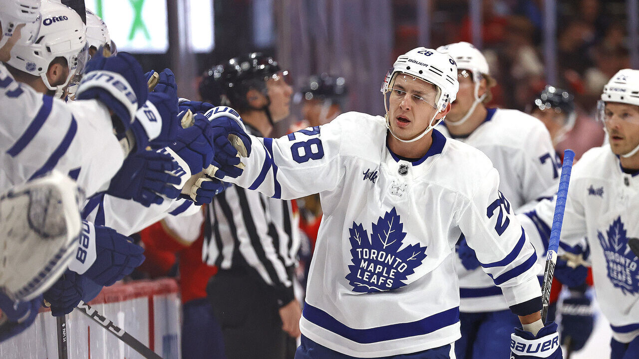 SUNRISE, FLORIDA - DECEMBER 2: Troy Stecher #28 of the Toronto Maple Leafs celebrates his goal with teammates during the first period against the Florida Panthers at the Amerant Bank Arena on December 2, 2025 in Sunrise, Florida.