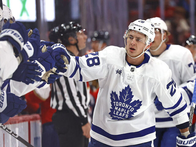 SUNRISE, FLORIDA - DECEMBER 2: Troy Stecher #28 of the Toronto Maple Leafs celebrates his goal with teammates during the first period against the Florida Panthers at the Amerant Bank Arena on December 2, 2025 in Sunrise, Florida.