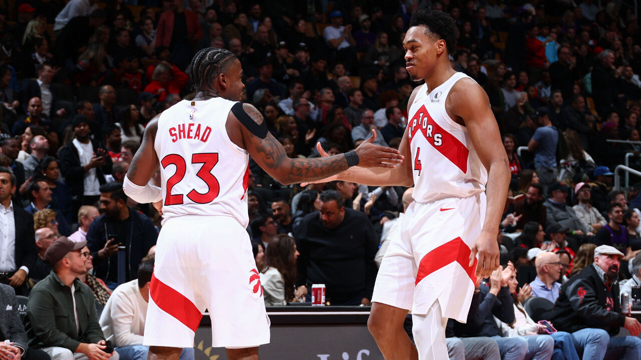 TORONTO, CANADA - DECEMBER 2: Jamal Shead #23 and Scottie Barnes #4 of the Toronto Raptors high five during the game against the Portland Trail Blazers on December 2, 2025 at the Scotiabank Arena in Toronto, Ontario, Canada. Mandatory Copyright Notice: Copyright 2025 NBAE