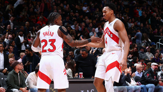 TORONTO, CANADA - DECEMBER 2: Jamal Shead #23 and Scottie Barnes #4 of the Toronto Raptors high five during the game against the Portland Trail Blazers on December 2, 2025 at the Scotiabank Arena in Toronto, Ontario, Canada. Mandatory Copyright Notice: Copyright 2025 NBAE