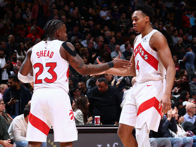 TORONTO, CANADA - DECEMBER 2: Jamal Shead #23 and Scottie Barnes #4 of the Toronto Raptors high five during the game against the Portland Trail Blazers on December 2, 2025 at the Scotiabank Arena in Toronto, Ontario, Canada. Mandatory Copyright Notice: Copyright 2025 NBAE