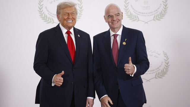 FIFA President Gianni Infantino (R) and US President Donald Trump pose during a summit on Gaza in Sharm el-Sheikh on October 13, 2025. Trump landed in Egypt on October 13 for a summit on Gaza, following a lightning visit to Israel after a ceasefire he brokered entered into force