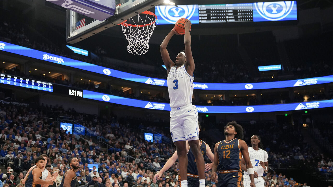 SALT LAKE CITY, UT - DECEMBER 03: AJ Dybantsa #3 of the BYU Cougars dunks during a college basketball game between the Cal Baptist Lancers and the BYU Cougars on December 3rd, 2025 at the Delta Center in Salt Lake City, UT.