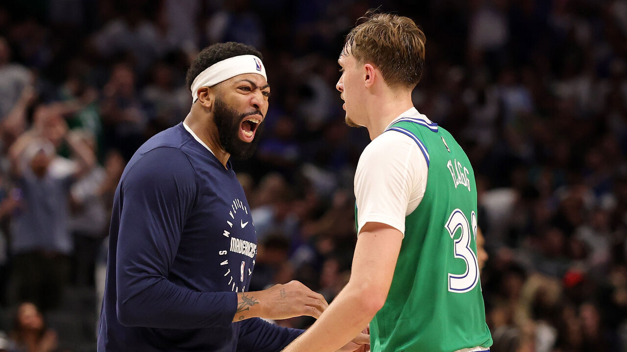 DALLAS, TEXAS - OCTOBER 26: Cooper Flagg #32 of the Dallas Mavericks is congratulated by Anthony Davis #3 following a dunk during the second half against the Toronto Raptors at American Airlines Center on October 26, 2025 in Dallas, Texas.