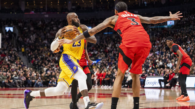 TORONTO, ON - DECEMBER 4: LeBron James #23 of the Los Angeles Lakers goes to the basket as Brandon Ingram #3 of the Toronto Raptors defends during first half action at Scotiabank Arena on December 4, 2025 in Toronto, Ontario, Canada. NOTE TO USER: User expressly acknowledges and agrees that, by downloading and/or using this Photograph, user is consenting to the terms and conditions of the Getty Images License Agreement.