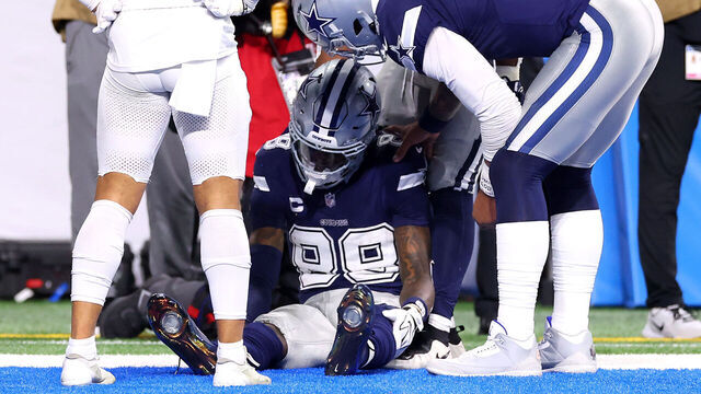 DETROIT, MICHIGAN - DECEMBER 04: Dak Prescott #4 checks on CeeDee Lamb #88 of the Dallas Cowboys after he dropped a ball in the end zone and left the game against the Detroit Lions during the third quarter at Ford Field on December 04, 2025 in Detroit, Michigan.