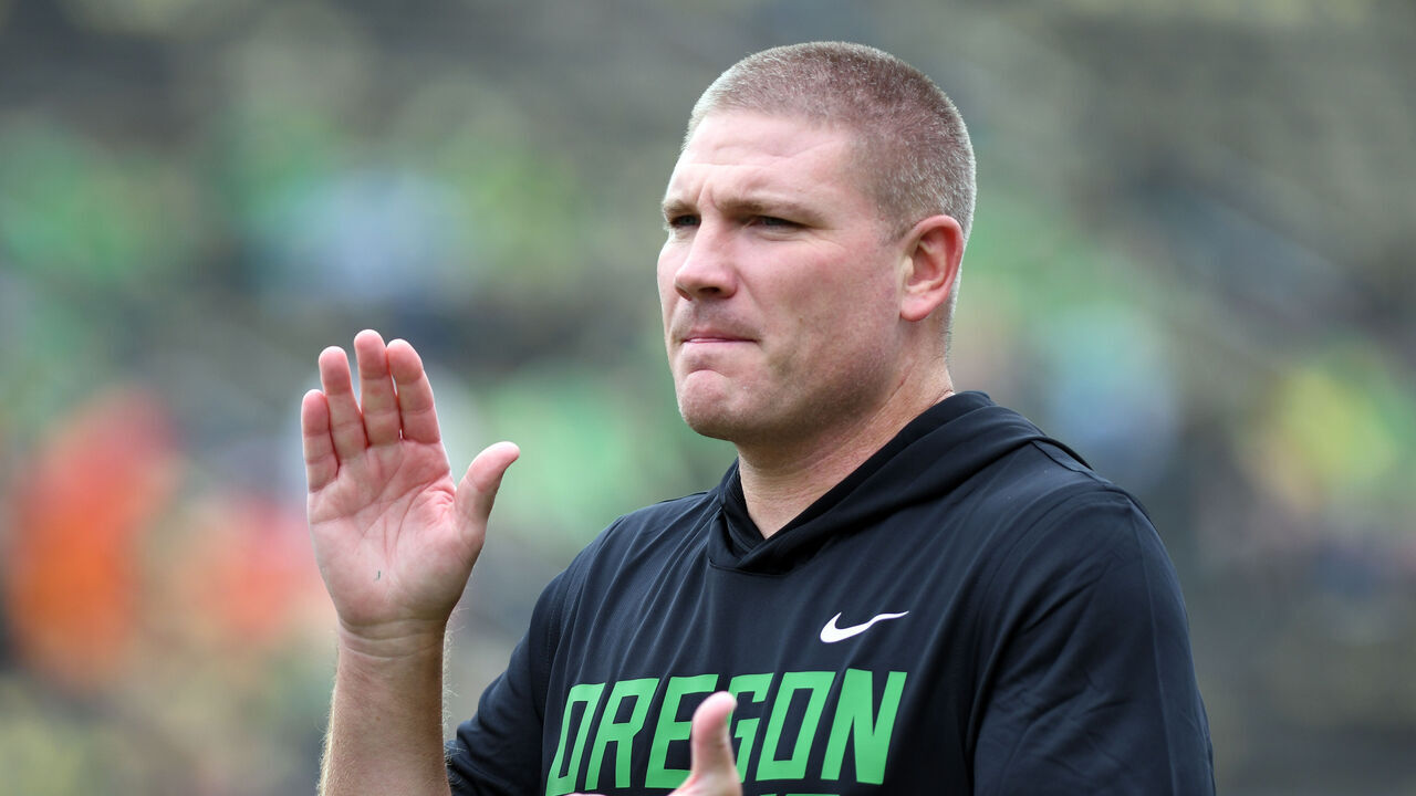 EUGENE, OR - SEPTEMBER 06: Oregon Ducks defensive coordinator and linebackers coach Tosh Lupoi coaches pregame drills during a college football game between the Oklahoma State Cowboys and the Oregon Ducks on September 6, 2025, at Autzen Stadium in Eugene, Oregon.