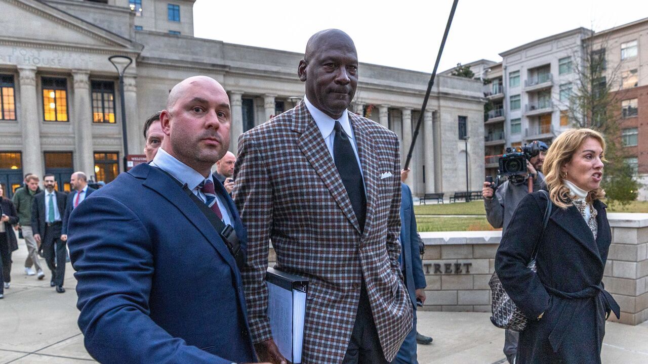 CHARLOTTE, NORTH CAROLINA - DECEMBER 1: Michael Jordan, co-owner of 23XI Racing, departs the Charles R Jonas Federal Building on December 1, 2025 in Charlotte, North Carolina. Jury selection and an opening statement began an antitrust lawsuit filed by Jordan's 23XI Racing team against NASCAR.