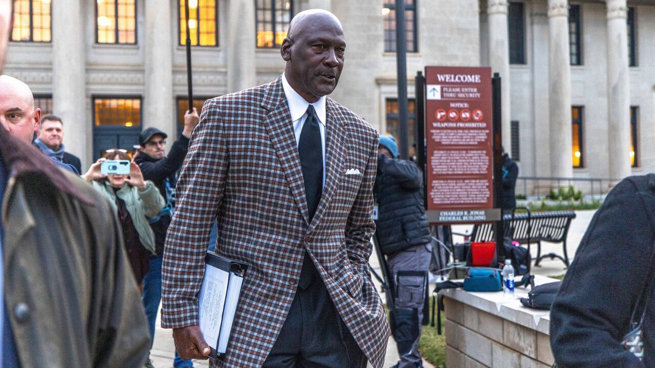 CHARLOTTE, NORTH CAROLINA - DECEMBER 1: Michael Jordan, co-owner of 23XI Racing, departs the Charles R Jonas Federal Building on December 1, 2025 in Charlotte, North Carolina. Jury selection and an opening statement began an antitrust lawsuit filed by Jordan's 23XI Racing team against NASCAR.