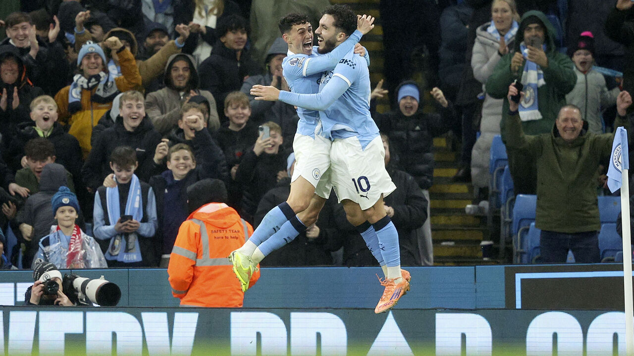 MANCHESTER, ENGLAND - DECEMBER 6: Phil Foden of Manchester City and Rayan Cherki of Manchester City celebrate 4th goal during the Premier League match between Manchester City and Sunderland at Etihad Stadium on December 6, 2025 in Manchester, England.