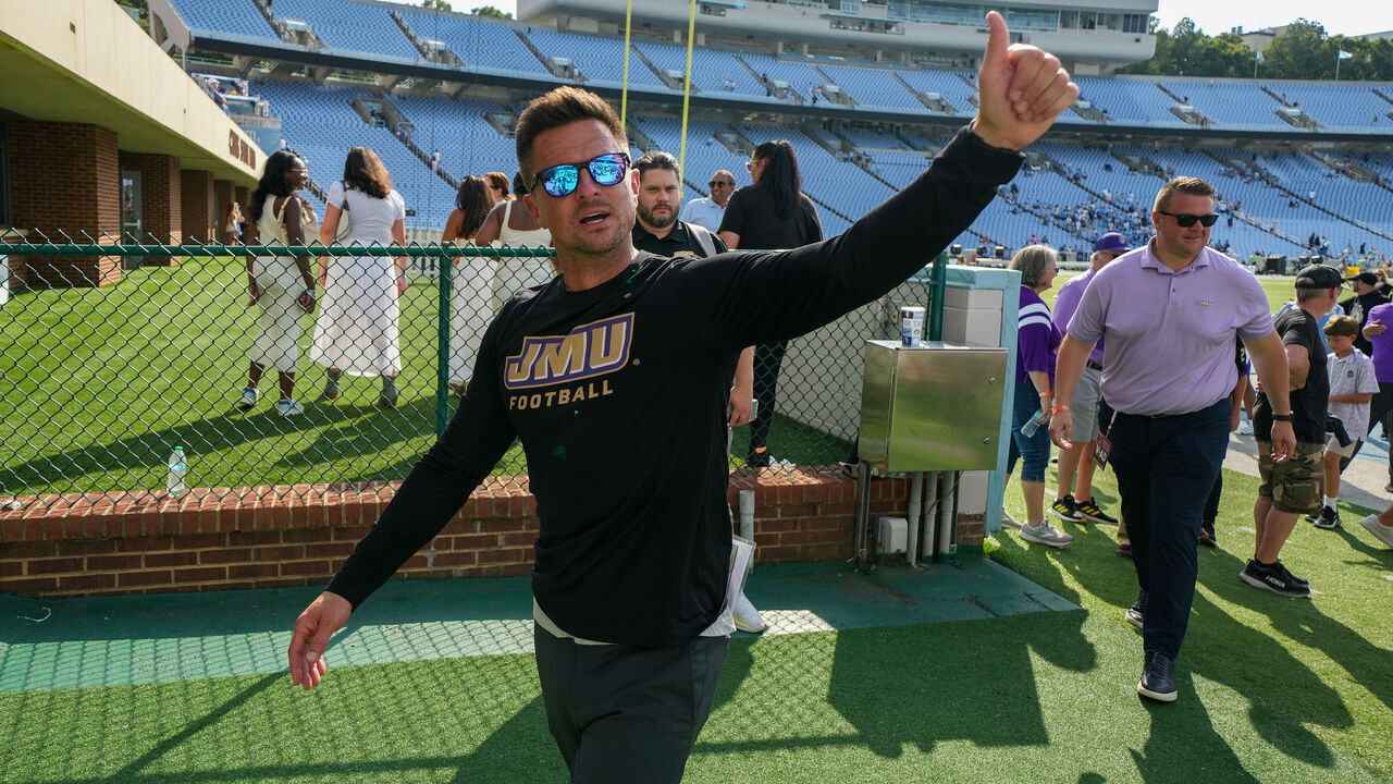 CHAPEL HILL, NORTH CAROLINA - SEPTEMBER 21: Head coach Bob Chesney of the James Madison Dukes reacts as he leaves the field after a win against the North Carolina Tar Heels at Kenan Memorial Stadium on September 21, 2024 in Chapel Hill, North Carolina. The Dukes won 70-50.