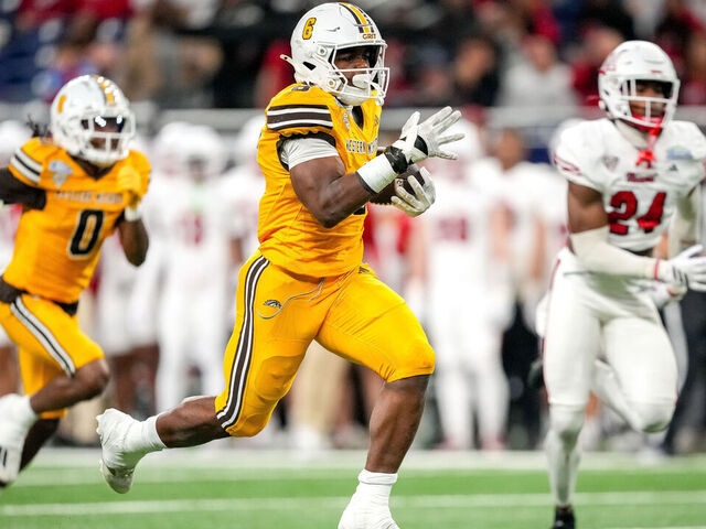 DETROIT, MICHIGAN - DECEMBER 06: Jalen Buckley #6 of the Western Michigan Broncos runs to score a touchdown against the Miami (OH) RedHawks during the first quarter of the 2025 MAC Football Championship at Ford Field on December 06, 2025 in Detroit, Michigan.