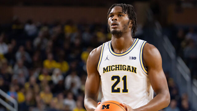 ANN ARBOR, MICHIGAN - NOVEMBER 3: Morez Johnson Jr. #21 of the Michigan Wolverines prepares to shoot a free throw during the first half against the Oakland Golden Grizzlies at Crisler Arena on November 3, 2025 in Ann Arbor, Michigan.
