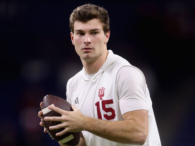 INDIANAPOLIS, INDIANA - DECEMBER 06: Fernando Mendoza #15 of the Indiana Hoosiers warms up before the 2025 Big Ten Football Championship against the Ohio State Buckeyes at Lucas Oil Stadium on December 06, 2025 in Indianapolis, Indiana.