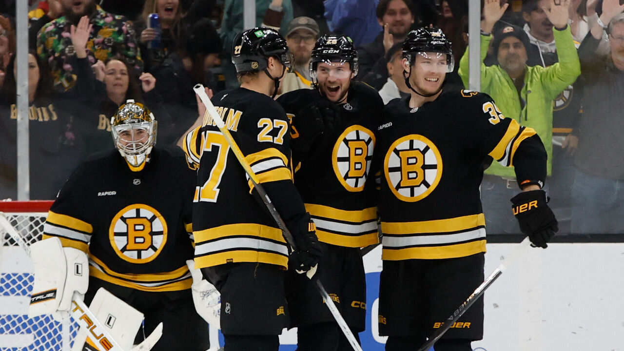 BOSTON, MASSACHUSETTS - DECEMBER 06: Andrew Peeke #26 of the Boston Bruins celebrates his goal against the New Jersey Devils with teammates Hampus Lindholm #27, Morgan Geekie #39 and Jeremy Swayman #1 during the third period at the TD Garden on December 6, 2025 in Boston, Massachusetts. The Bruins won 4-1.
