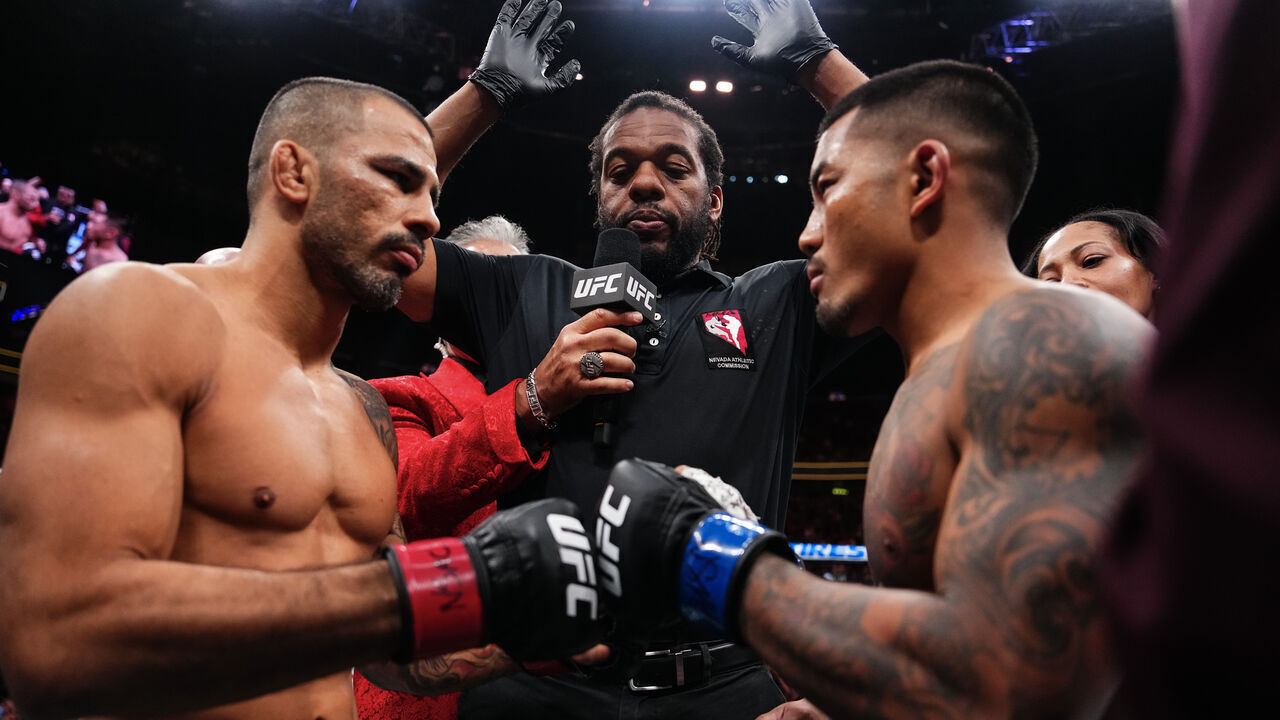 LAS VEGAS, NEVADA - DECEMBER 06: (L-R) Alexandre Pantoja of Brazil and Joshua Van of Myanmar touch gloves in the UFC flyweight championship fight during the UFC 323 event at T-Mobile Arena on December 06, 2025 in Las Vegas, Nevada.