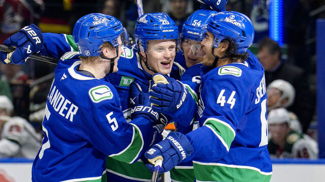 VANCOUVER, CANADA - DECEMBER 6: Elias Pettersson #25 of the Vancouver Canucks celebrates his goal with teammates during the second period of their NHL game against the Minnesota Wild at Rogers Arena on December 6, 2025 in Vancouver, British Columbia, Canada.