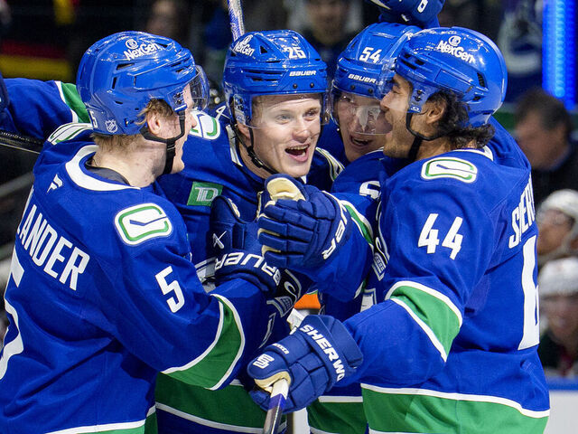 VANCOUVER, CANADA - DECEMBER 6: Elias Pettersson #25 of the Vancouver Canucks celebrates his goal with teammates during the second period of their NHL game against the Minnesota Wild at Rogers Arena on December 6, 2025 in Vancouver, British Columbia, Canada.