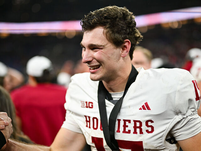 INDIANAPOLIS, IN - DECEMBER 06: Indiana Hoosiers QB Fernando Mendoza (15) celebrates winning the Big Ten Championship football game between the Indiana Hoosiers and the Ohio State Buckeyes on December 6, 2025 at Lucas Oil Stadium in Indianapolis, IN.