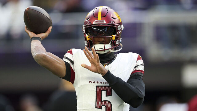 MINNEAPOLIS, MINNESOTA - DECEMBER 07: Jayden Daniels #5 of the Washington Commanders warms up prior to a game against the Minnesota Vikings at U.S. Bank Stadium on December 07, 2025 in Minneapolis, Minnesota.