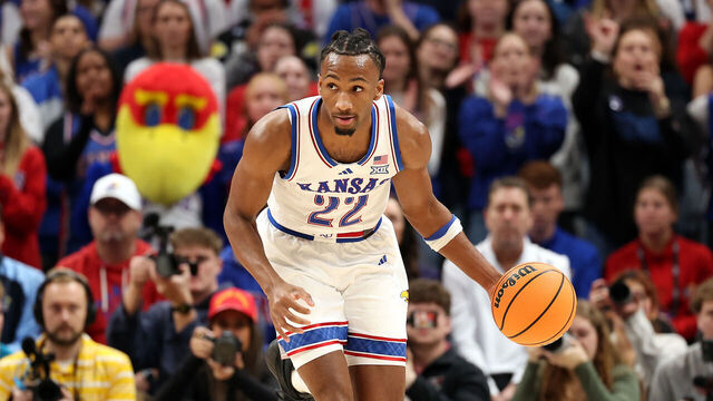 KANSAS CITY, MISSOURI - DECEMBER 07: Darryn Peterson #22 of the Kansas Jayhawks controls the ball during the game against the Missouri Tigers at T-Mobile Center on December 07, 2025 in Kansas City, Missouri.