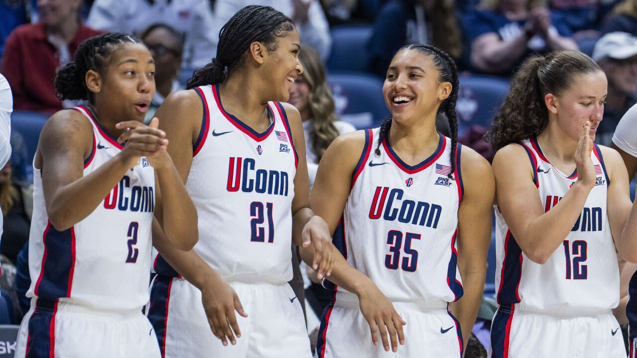 STORRS, CONNECTICUT - DECEMBER 07: KK Arnold #2, Sarah Strong #21 and Azzi Fudd #35 of the Connecticut Huskies react during the second half of an NCAA women's basketball game against the DePaul Blue Demons at Harry A. Gampel Pavilion on December 07, 2025 in Storrs, Connecticut.