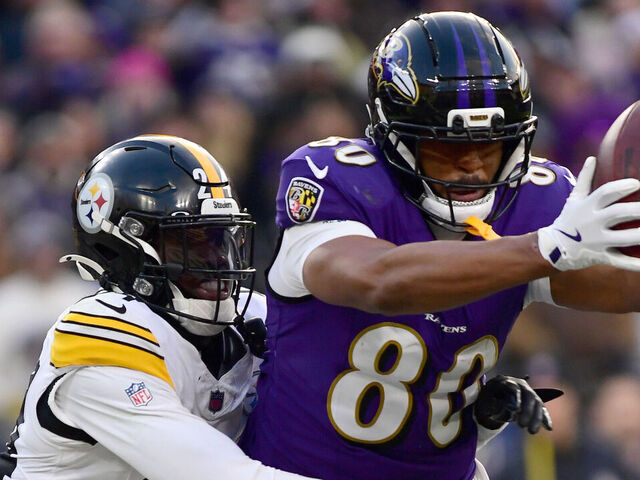 BALTIMORE, MD - DECEMBER 07: Ravens tight end Isaiah Likely (80) makes a catch in the end zone, which is popped out of his hands by Steelers cornerback Joey Porter, Jr. (24) and ruled not a touchdown late in the fourth quarter during the Pittsburgh Steelers versus Baltimore Ravens NFL game at M&T Bank Stadium on December 7, 2025 in Baltimore, MD.