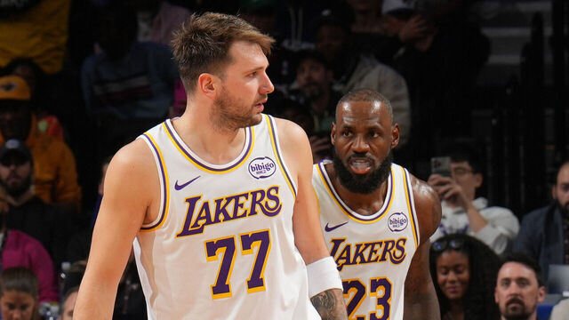 PHILADELPHIA, PA - DECEMBER 7:Luka Doncic #77 and LeBron James #23 of the Los Angeles Lakers looks on during the game against the Philadelphia 76ers on December 7, 2025 at the Wells Fargo Center in Philadelphia, Pennsylvania NOTE TO USER: User expressly acknowledges and agrees that, by downloading and/or using this Photograph, user is consenting to the terms and conditions of the Getty Images License Agreement. Mandatory Copyright Notice: Copyright 2025 NBAE