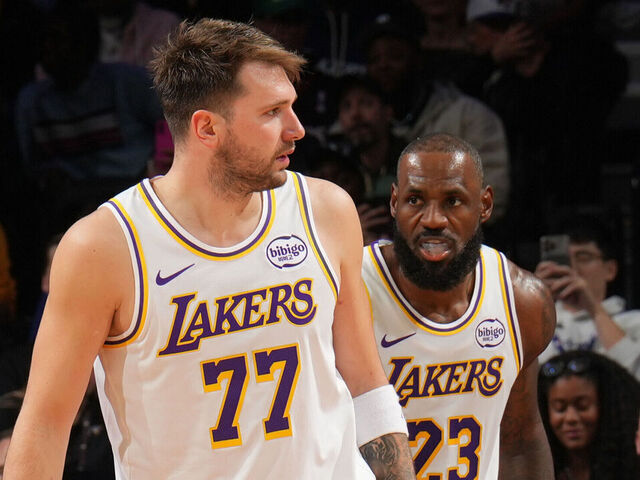 PHILADELPHIA, PA - DECEMBER 7:Luka Doncic #77 and LeBron James #23 of the Los Angeles Lakers looks on during the game against the Philadelphia 76ers on December 7, 2025 at the Wells Fargo Center in Philadelphia, Pennsylvania NOTE TO USER: User expressly acknowledges and agrees that, by downloading and/or using this Photograph, user is consenting to the terms and conditions of the Getty Images License Agreement. Mandatory Copyright Notice: Copyright 2025 NBAE