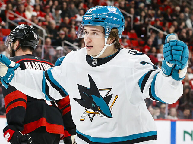 RALEIGH, NORTH CAROLINA - DECEMBER 07: Macklin Celebrini #71 of the San Jose Sharks reacts to a first period goal against the Carolina Hurricanes at the Lenovo Center on December 07, 2025 in Raleigh, North Carolina.
