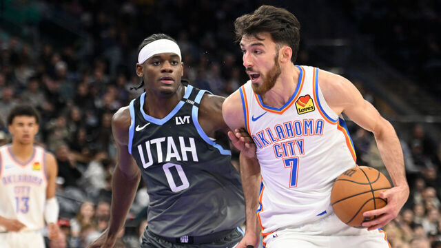 SALT LAKE CITY, UTAH - DECEMBER 07: Chet Holmgren #7 of the Oklahoma City Thunder drives into Taylor Hendricks #0 of the Utah Jazz during the second half of a game at Delta Center on December 07, 2025 in Salt Lake City, Utah.
