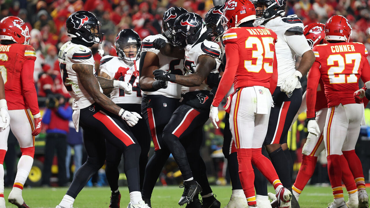 KANSAS CITY, MISSOURI - DECEMBER 07: Dare Ogunbowale #33 of the Houston Texans celebrates with teammates after scoring a rushing touchdown against the Kansas City Chiefs during the fourth quarter at Arrowhead Stadium on December 07, 2025 in Kansas City, Missouri.