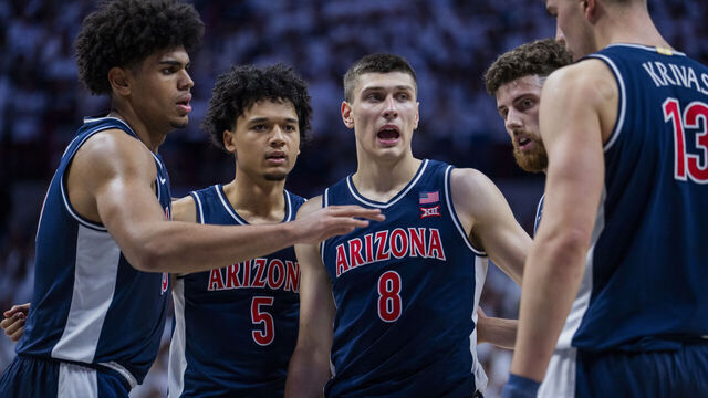 STORRS, CONNECTICUT - NOVEMBER 19: Koa Peat #10, Brayden Burries #5, Ivan Kharchenkov #8, Anthony Dell'Orso #3 and Motiejus Krivas #13 of the Arizona Wildcats huddle up against the Connecticut Huskies during the first half of an NCAA men's basketball game at Harry A. Gampel Pavilion on November 19, 2025 in Storrs, Connecticut.