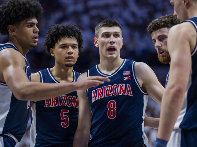 STORRS, CONNECTICUT - NOVEMBER 19: Koa Peat #10, Brayden Burries #5, Ivan Kharchenkov #8, Anthony Dell'Orso #3 and Motiejus Krivas #13 of the Arizona Wildcats huddle up against the Connecticut Huskies during the first half of an NCAA men's basketball game at Harry A. Gampel Pavilion on November 19, 2025 in Storrs, Connecticut.