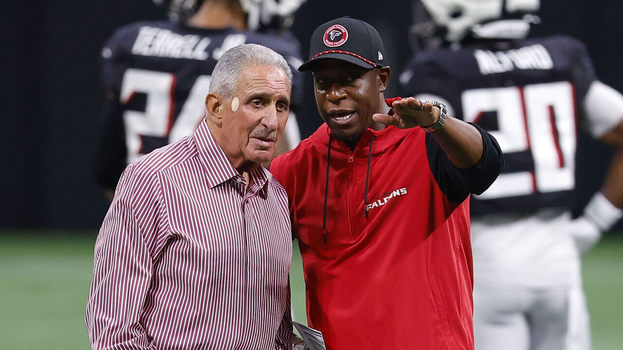 ATLANTA, GEORGIA - AUGUST 2: Atlanta Falcons owner Arthur Blank speaks with head coach Raheem Morris during NFL training camp at Mercedes-Benz Stadium on August 2, 2024 in Atlanta, Georgia.