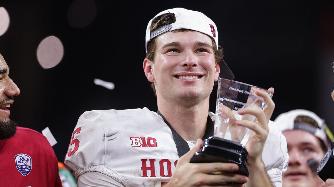 INDIANAPOLIS, INDIANA - DECEMBER 6: Fernando Mendoza #15 of the Indiana Hoosiers holds the MVP trophy after the 2025 Big Ten Championship game against the Ohio State Buckeyes at Lucas Oil Stadium on December 6, 2025 in Indianapolis, Indiana.