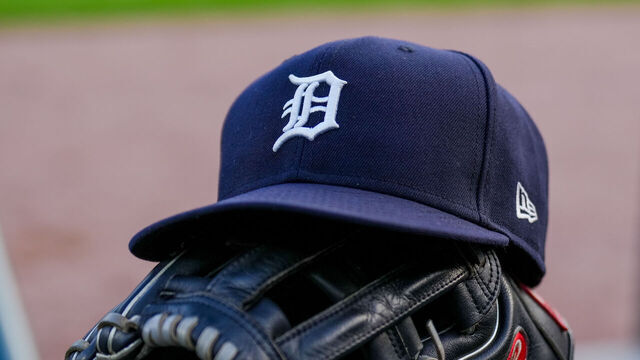 DETROIT, MICHIGAN - JUNE 25: A detail of a New Era Detroit Tigers baseball hat and Rawlings baseball glove during the game against the Athletics at Comerica Park on June 25, 2025 in Detroit, Michigan.